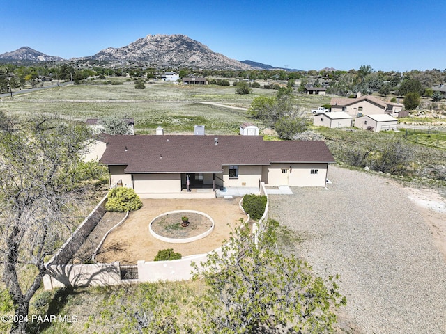 birds eye view of property with a mountain view