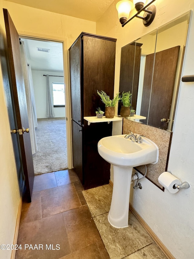 bathroom with a shower with shower door