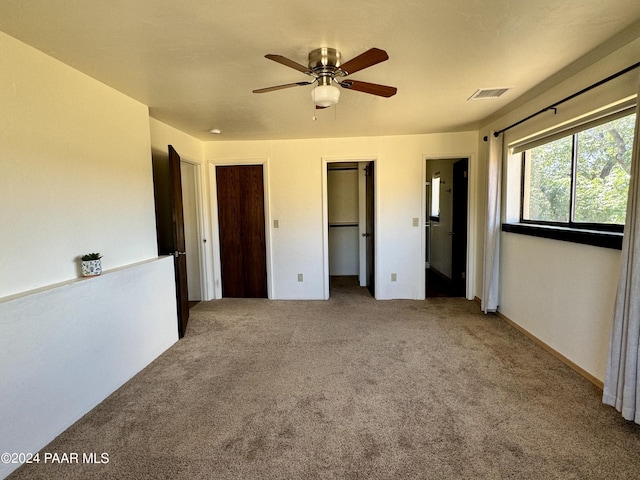 unfurnished bedroom featuring carpet flooring and ceiling fan