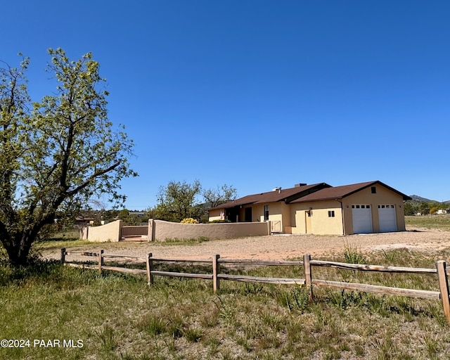 view of front of property featuring a garage