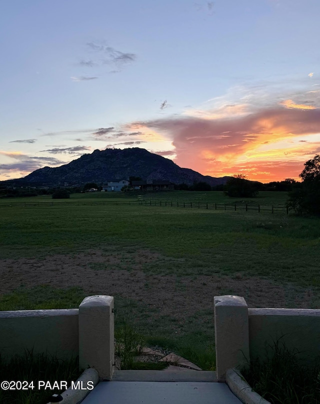 mountain view featuring a rural view