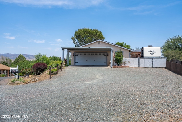 11755 Hondo Hts, Dewey-Humboldt, AZ 86327 - ranch-style home featuring driveway, a gate, stucco siding, a mountain view, and a garage