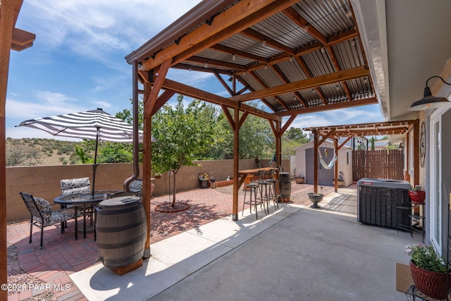 11755 Hondo Hts, Dewey-Humboldt, AZ 86327 - fenced backyard featuring a patio area, cooling unit, and outdoor dining space