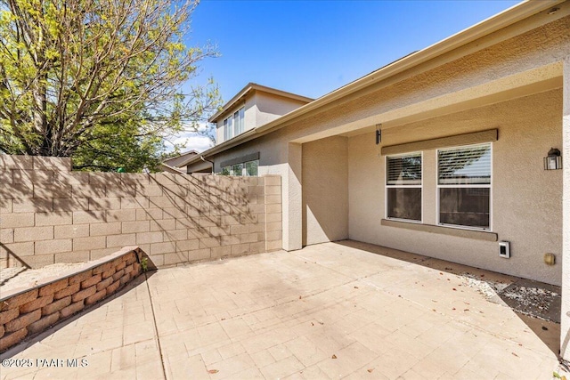view of patio / terrace with fence