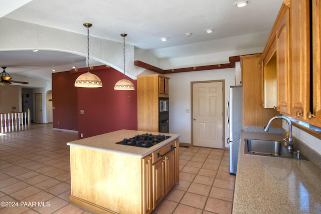 kitchen featuring ceiling fan, black appliances, sink, hanging light fixtures, and lofted ceiling