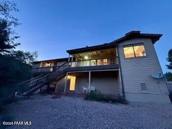 back of property with a balcony