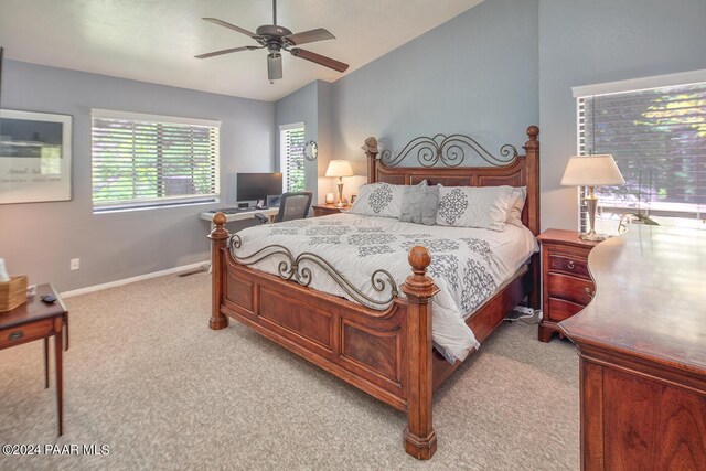 carpeted bedroom featuring ceiling fan and lofted ceiling