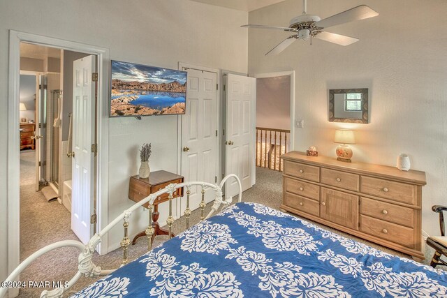 bedroom featuring light colored carpet and ceiling fan