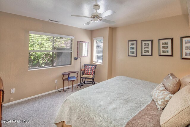 bedroom featuring ceiling fan and carpet floors