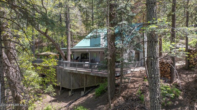 rear view of house with a wooden deck