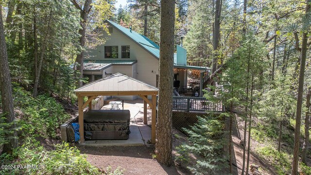 back of property with a wooden deck