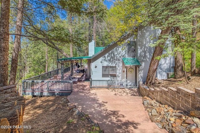 view of front of property featuring a patio