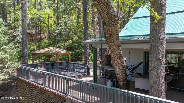 wooden deck featuring a gazebo