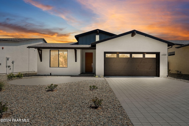 1324 Rockwood Dr, Prescott, AZ 86305 - view of front of property with an attached garage, decorative driveway, and stucco siding