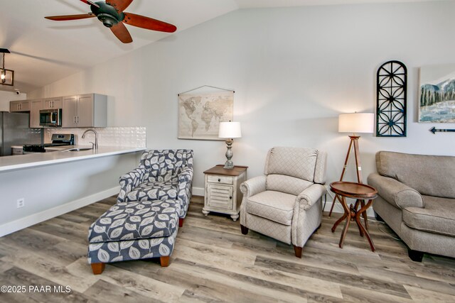 2151 S Resort Way Unit 1C, Prescott, AZ 86301 - sitting room with baseboards, wood finished floors, vaulted ceiling, and a ceiling fan