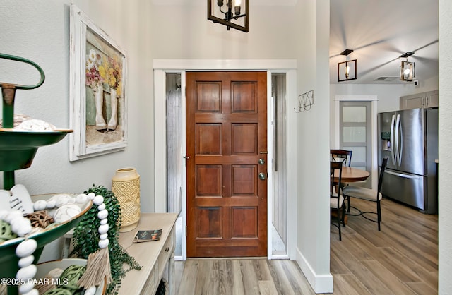 2151 S Resort Way Unit 1C, Prescott, AZ 86301 - foyer entrance with visible vents, baseboards, and light wood finished floors