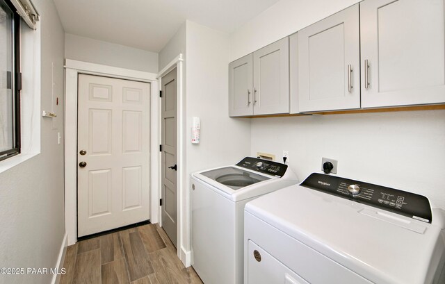2151 S Resort Way Unit 1C, Prescott, AZ 86301 - laundry room with cabinet space, baseboards, light wood-type flooring, and separate washer and dryer