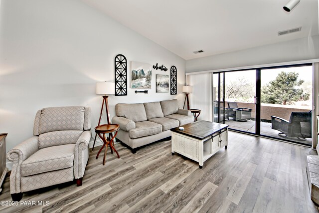 2151 S Resort Way Unit 1C, Prescott, AZ 86301 - living area featuring visible vents, light wood-style flooring, and lofted ceiling