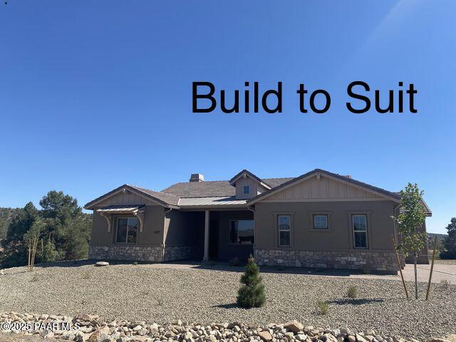 view of front of home featuring stone siding