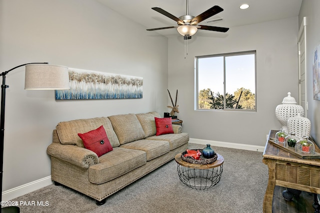 living area featuring visible vents, a ceiling fan, baseboards, and carpet flooring