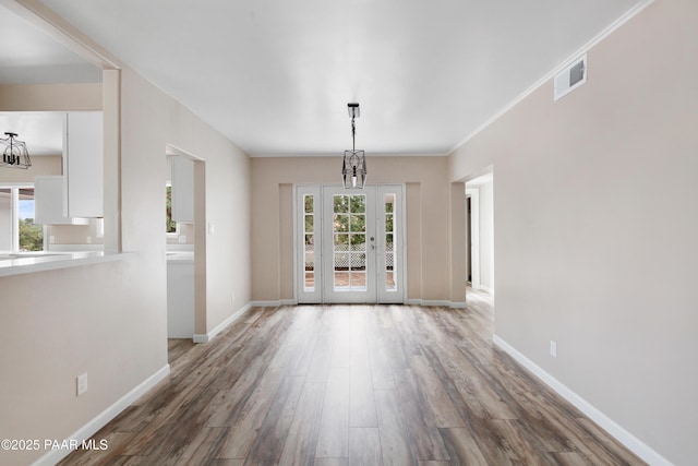315 N Robinson Dr, Prescott, AZ 86303 - unfurnished dining area with wood finished floors, baseboards, and a chandelier