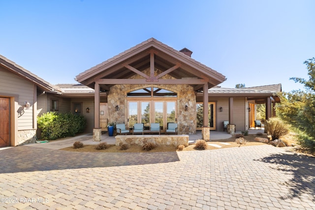 exterior space with stone siding