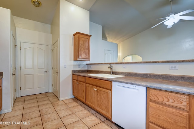 kitchen with ceiling fan, light tile patterned flooring, dishwasher, vaulted ceiling, and sink