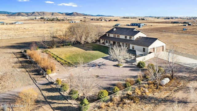 drone / aerial view with a mountain view and a rural view