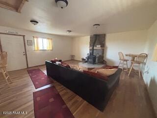 16432 Incline Trl, Williams, AZ 86046 - living area featuring a wood stove and wood finished floors