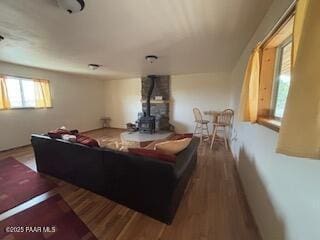 16432 Incline Trl, Williams, AZ 86046 - living room with a wood stove and wood finished floors