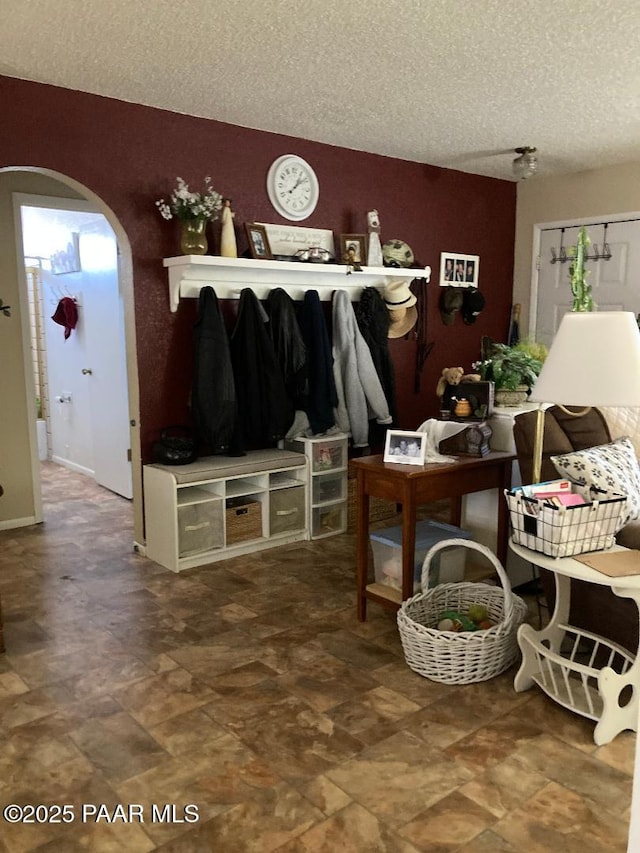 3718 N Navajo Dr, Prescott Valley, AZ 86314 - mudroom with arched walkways and a textured ceiling