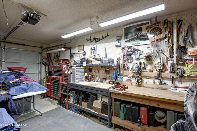 3718 N Navajo Dr, Prescott Valley, AZ 86314 - garage with a workshop area and a garage door opener
