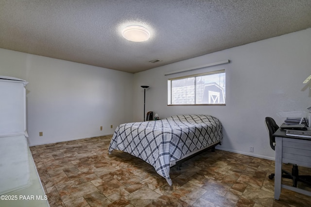 3718 N Navajo Dr, Prescott Valley, AZ 86314 - bedroom featuring stone finish floor, a textured ceiling, and visible vents