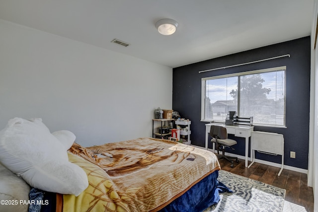 3718 N Navajo Dr, Prescott Valley, AZ 86314 - bedroom featuring wood finished floors, visible vents, and baseboards