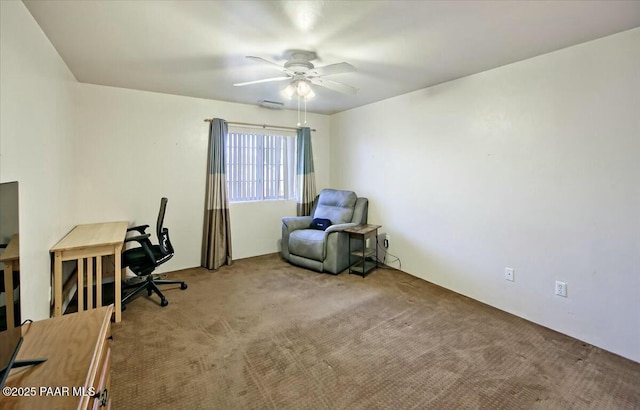 carpeted home office with ceiling fan