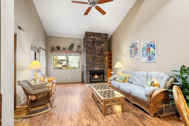 229 Creekside Cir Unit 15C, Prescott, AZ 86303 - living area with ceiling fan, hardwood / wood-style flooring, a fireplace, and high vaulted ceiling
