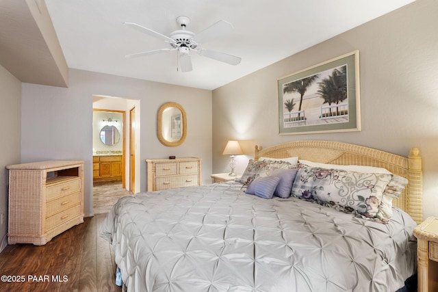 229 Creekside Cir Unit 15C, Prescott, AZ 86303 - bedroom featuring dark wood-style flooring, connected bathroom, a ceiling fan, and a sink