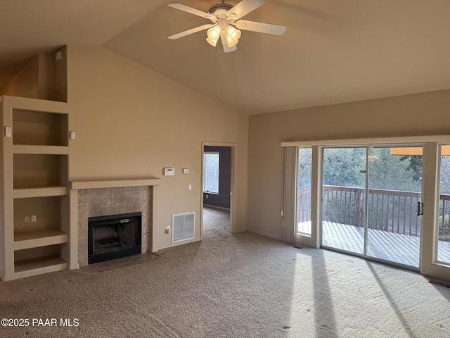 2508 N Leah Ln, Prescott, AZ 86301 - unfurnished living room featuring carpet flooring, ceiling fan, a fireplace, vaulted ceiling, and visible vents