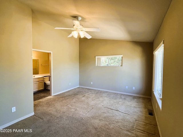 2508 N Leah Ln, Prescott, AZ 86301 - unfurnished bedroom featuring ensuite bath, carpet, baseboards, lofted ceiling, and visible vents