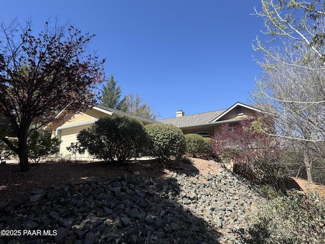 2508 N Leah Ln, Prescott, AZ 86301 - view of property exterior featuring an attached garage and a chimney