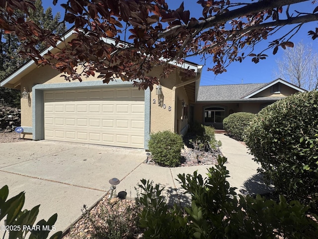 2508 N Leah Ln, Prescott, AZ 86301 - view of front of home with a garage, stucco siding, and driveway