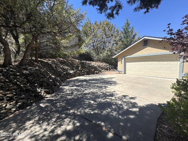 2508 N Leah Ln, Prescott, AZ 86301 - view of home's exterior with an attached garage, driveway, and stucco siding