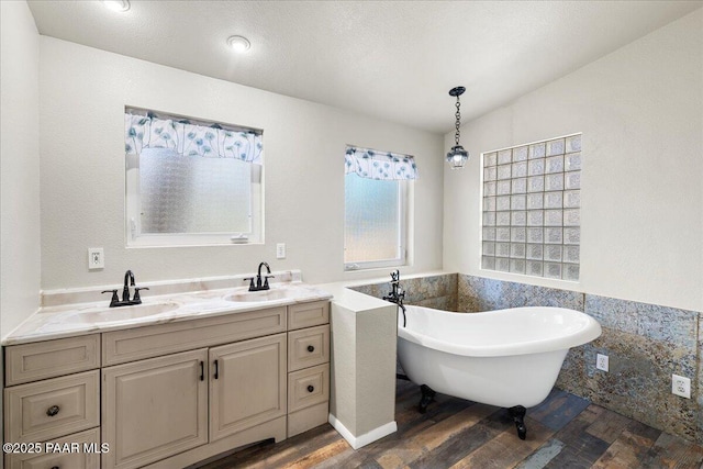 4820 S Lund Ct, Prescott, AZ 86303 - bathroom with wood finished floors, a soaking tub, and double vanity