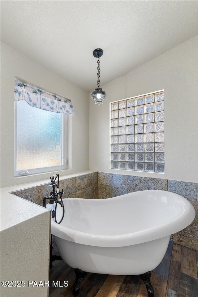 4820 S Lund Ct, Prescott, AZ 86303 - bathroom featuring a freestanding tub and wood finished floors