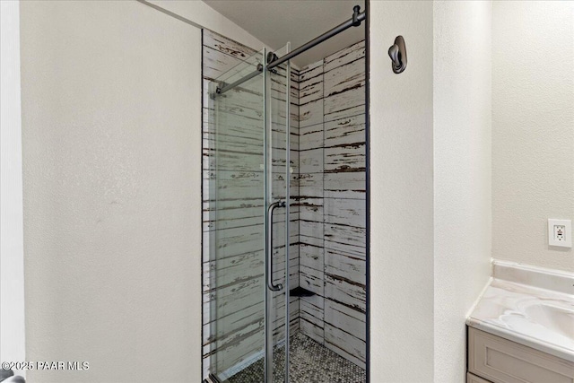 4820 S Lund Ct, Prescott, AZ 86303 - bathroom with a shower stall, vanity, and a textured wall