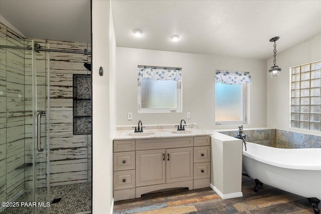 4820 S Lund Ct, Prescott, AZ 86303 - bathroom with wood finished floors, a shower stall, a freestanding tub, and double vanity