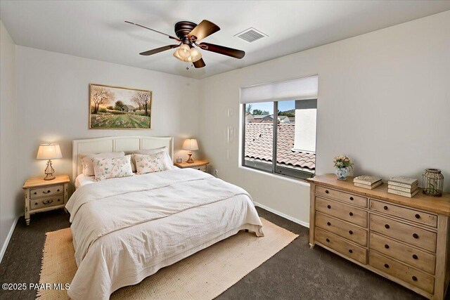 7273 Woolsey Ranch Rd, Prescott Valley, AZ 86314 - bedroom with dark colored carpet and a ceiling fan