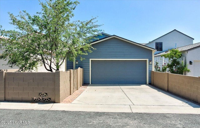 7273 Woolsey Ranch Rd, Prescott Valley, AZ 86314 - view of front facade featuring an attached garage and concrete driveway