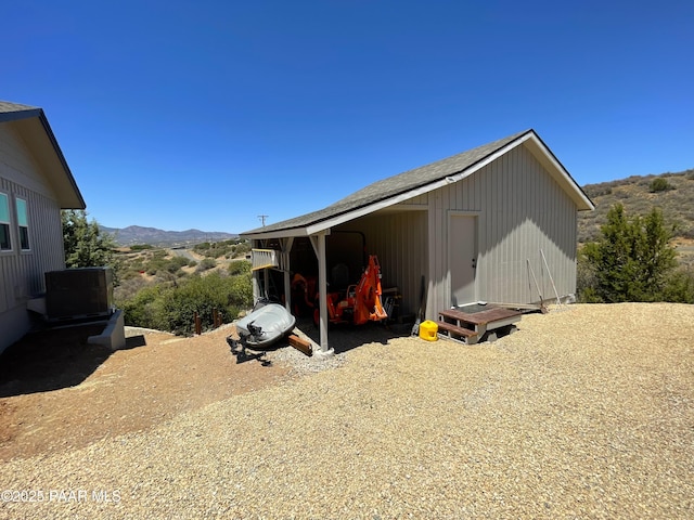 14600 E Eagle Dr, Dewey-Humboldt, AZ 86327 - view of side of home featuring a mountain view and an outbuilding