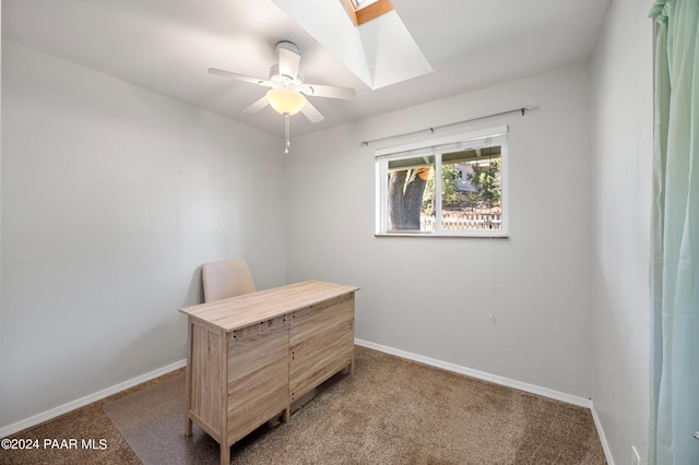 interior space with ceiling fan and a skylight